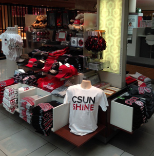 T-shirts and other CSUN-branded items on display in a kiosk.