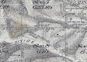 A gray map with a dot pinpointing the location of Ballard's house.