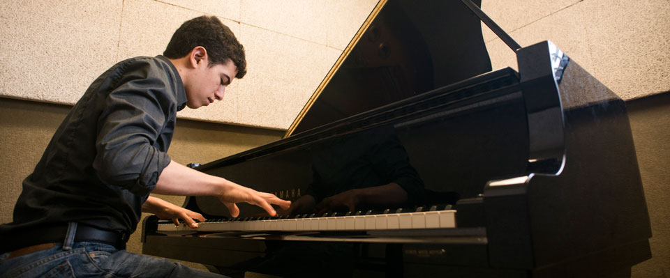 After double majoring in piano performance and economics at CSUN, Benjamin Krasner, 16, will head to Yale University on a full scholarship this fall to pursue a master’s degree in music. Photo by Lee Choo.