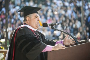 Alumnus Harvey Bookstein, in cap and gown, addresses CSUN graduates in 2016 after he received an honorary doctorate.