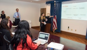 Los Angeles City Attorney Mike Feuer looks on as CSUN student Sarah Mendez makes her presentation. Photo by Lee Choo.