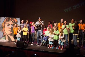 Singer Tom Morello performing at the 2015 CHIMEaPalooza with children from CHIME. Photo courtesy of the CHIME Institute.