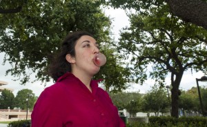 Christine Michaels blows bubbles on a stone bench after seven months of being smoke-free. Photo by Ruth Saravia. 