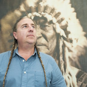 American Indian Studies director Brian Burkhart stands in his office. Photo by Luis Garcia. 
