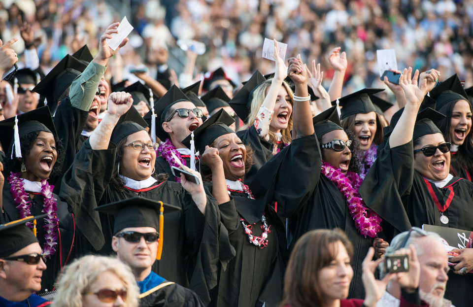 New CSUN graduates celebrate at Commencement 2014 in May on the Oviatt Library lawn. Photo by Lee Choo.