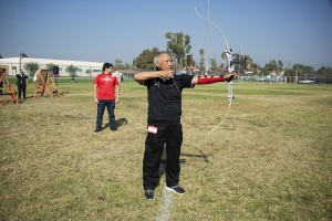 Reynaldo "Rene" Paguia, archery head coach for Associated Students sports clubs, tries out CSUN's new archery range. Photo by Lee Choo.