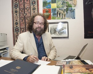 CSUN art history professor and 2016 Hanfmann Lectureship recipient Owen Doonan sits in his office. Photo by Luis Garcia. 