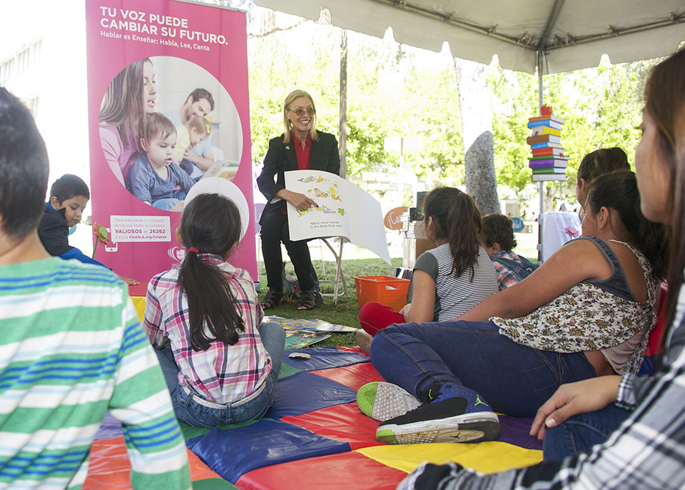 CSUN President Dianne F. Harrison reads to young people at the 2017 Feria de Educación. Photo by Sarah Dutton.