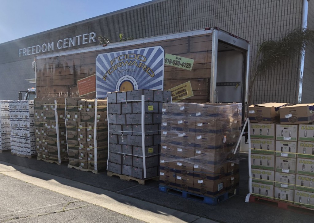 Pallets of fresh fruits and vegetables waiting for be distributed as part of CSUN's Healthy Living initiative in Canoga Park. Every month, approximately 4,100 individuals and families receive food as part of the effort. Photo courtesy of Brenda Gutierrez.