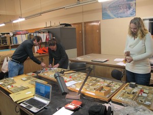 CSUN anthropology professor Hélène Rougier (center) identifies human skeletal remains among the collections from the Goyet cave in Belgium with colleagues from her project team, paleoanthropologist Dr. Isabelle Crevecoeur from Bordeaux University (right) and archeozoologist Cédric Beauval from Archéosphère in France (left). Photo provided by Hèléne Rougier. 