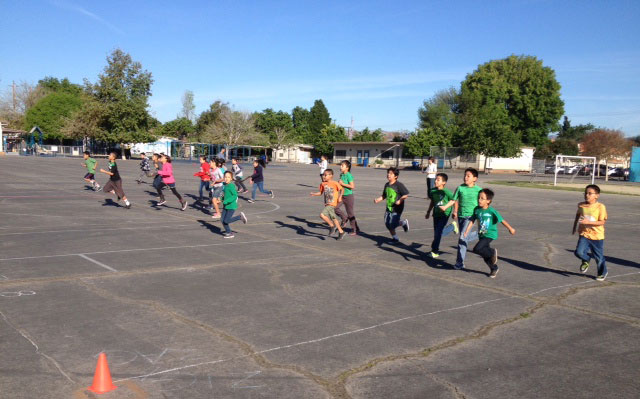 Students at Hart Street Elementary School in Canoga Park work on cardiovascular fitness and strength with CSUN kinesiology students. Photo courtesy of Terry Sweeting.