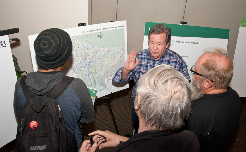 San Fernando Valley residents talk with a CSUN student about Metro transit's proposed November ballot measure to fund major area transit projects, at a community forum on May 16, 2016 at the University Student Union. Photo by David J. Hawkins.