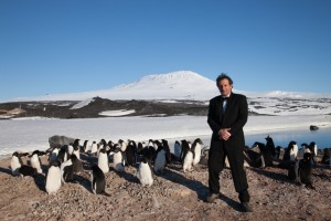 Michael Kelem with penguins in Antarctica. 
