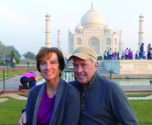Travel photo of Barry and Susan Goodman standing in front of the Taj Mahal in India.