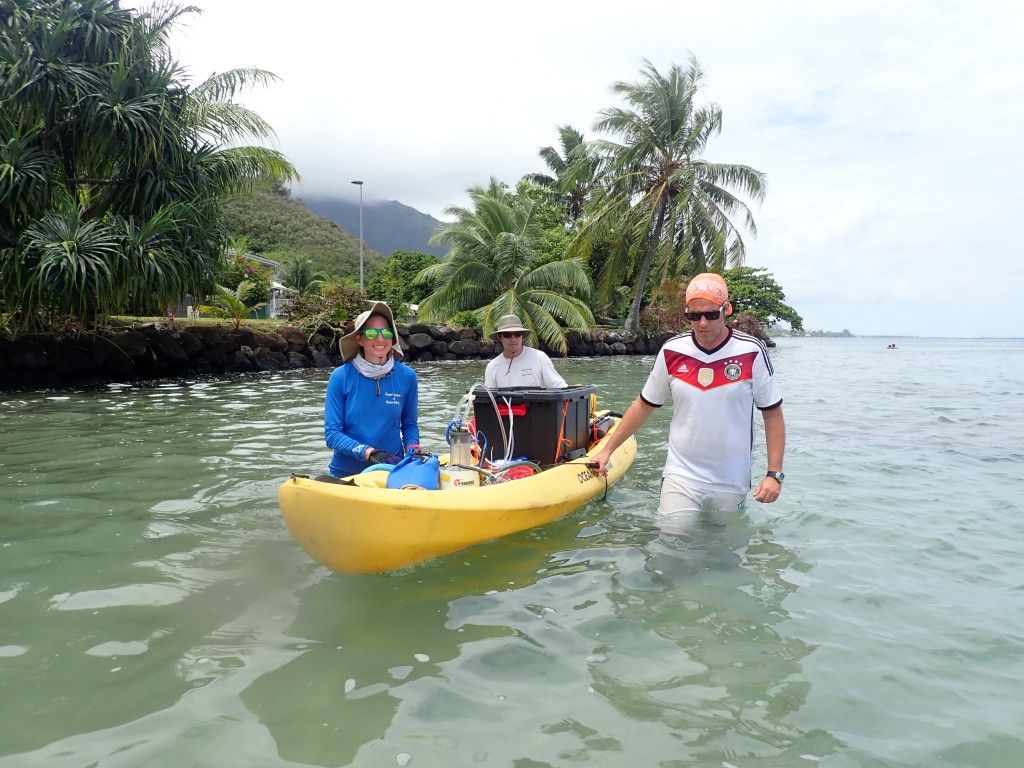 Nyssa Silbiger and two colleagues measuring groundwater from a kayak in Mo'orea French Polynesia. Photo courtesy of Megan Donahue