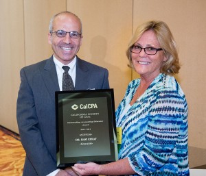 Rafi Efrat receiving the award from Chrislynn Freed, co-chair of the CalCPA's Accounting Education Committee. Photo courtesy of Efrat.