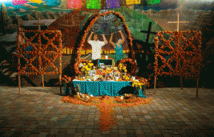 Ofrendas are decorated altars that honor and recall the lives of those who have passed. CSUN students decorated this community ofrenda outside the campus Chicana/o House for Dia de los Muertos, Oct. 30, 2015. Photo by Ruth Saravia.