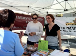 CSUN nutrition students at work talking to people at a farmers market. Photo courtesy of the College of Health and Human Development.