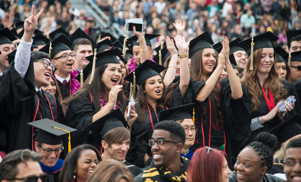Graduates celebrating at of California State University, Northridge's 2014 commencement ceremonies. Photo by Lee Choo.