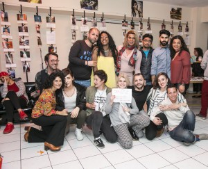 Dr. Moshoula Capous-Deyllas bottom left, co-researcher Milia Akkouris top right with members of LGBTQ+ Refugee Collective at art exhibition they curated in Greece