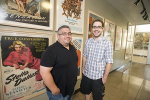 CSUN screenwriting alumni Joe Gonzalez, left, and Bradford Smith, right, stand inside the Mike Curb College of Arts, Media, and Communication. Photo by Lee Choo. 