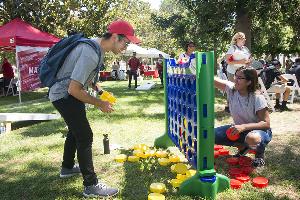 Playing Connect Four at President's Picnic.