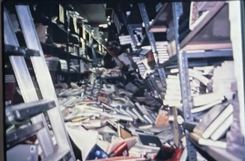 Hundreds of books lay in piles and askew amid twisted metal shelves, inside the catastrophic damage to the University Library, immediately after the 1994 Northridge earthquake.