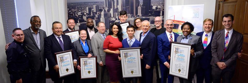 Pride Center's Sarina Loeb standing next to LGBT Heritage Month recipients in May 2018 at LA City Hall.