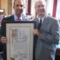 Robert Sidansky accepting his award from Councilman Mitchell Englander