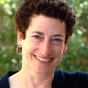 Naomi Oreskes standing in front of greenery