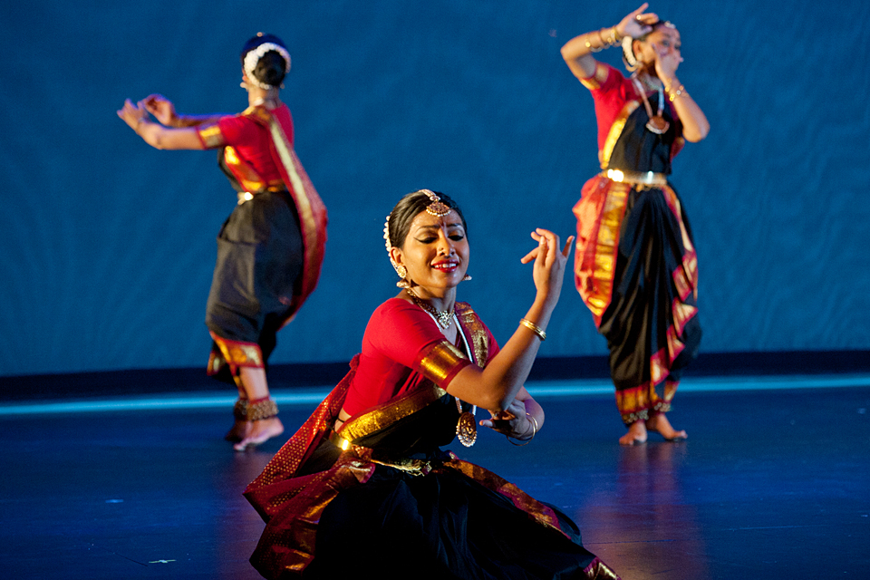 Three students performing a culturally inspired dance, titled “Tharana,” which fused three classic Indian dances. Shown on stage from left: Tharini Shanmugarajah, Monisha Jayakumar and Anjana Pathmarajah.