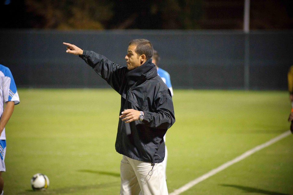 CSUN's associate head soccer coach Yossi Raz looks on from the sidelines.