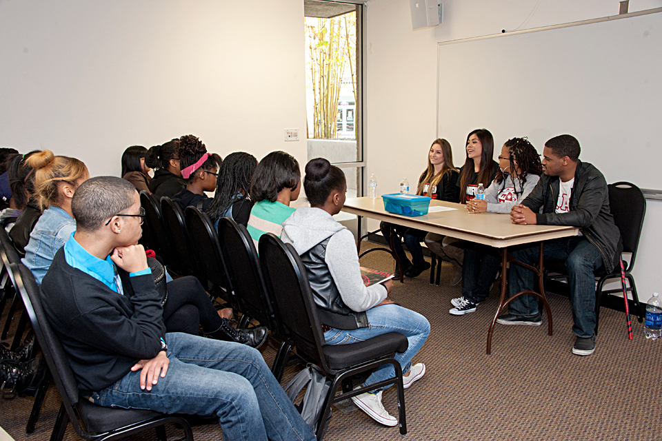 A group of high school students, alumni and CSUN students participating in a panel discussion.
