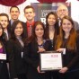 The CSUN team holding their award