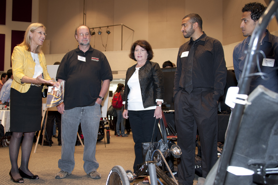 President Harrison with members of the human powered vehicle team