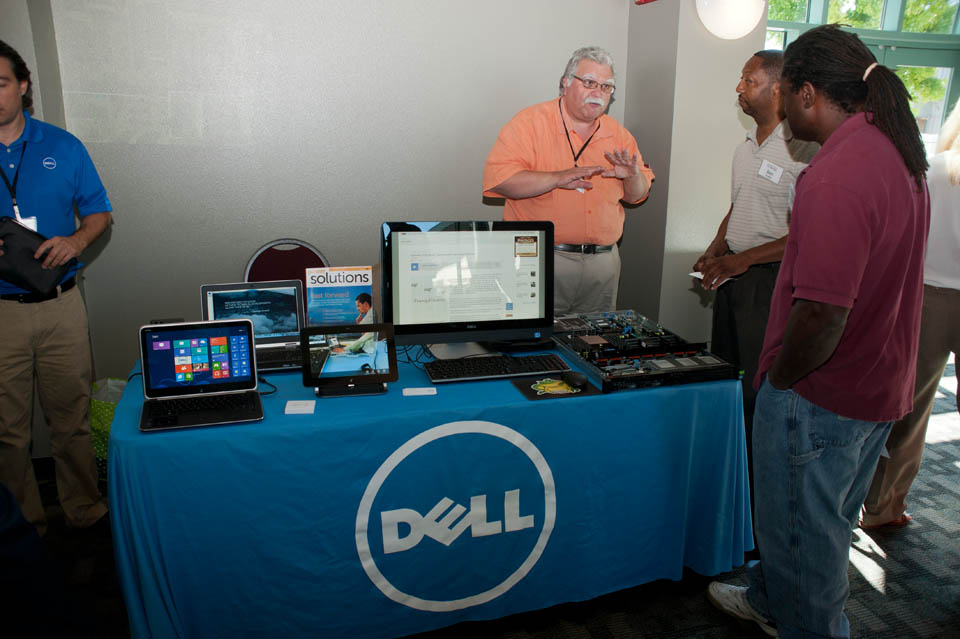 A Dell representative speaking with IT staff members