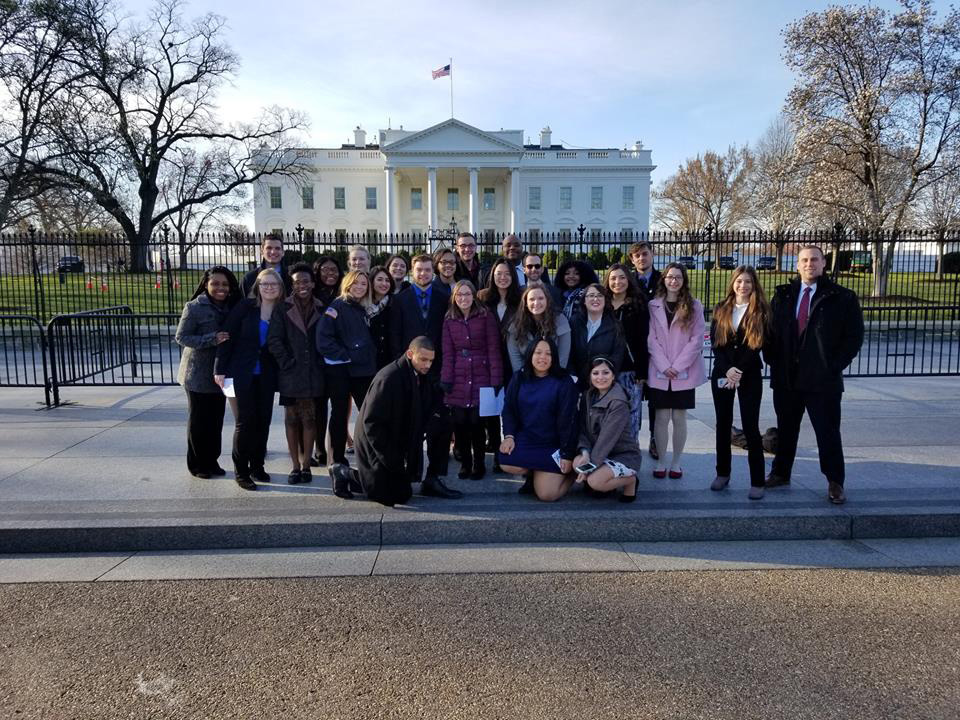 CSUN alumni and students from the National Millennial Community standing together in front of the White House in March 2018.