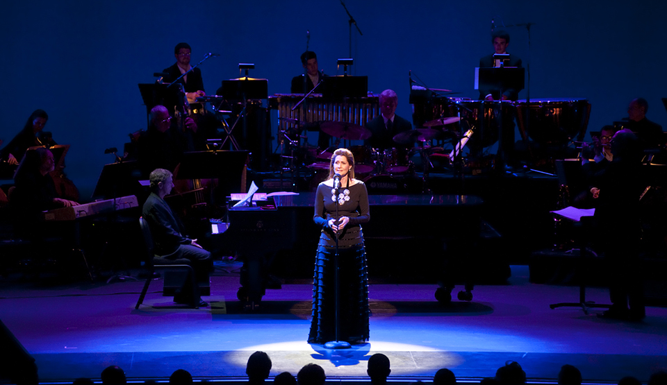 Singer Monica Mancini spotlit in front of the CSUN Symphony at the opening night of The Soraya in 2011.