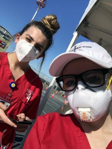 Ariel Dankner and Nina Amirian in scrubs and masks at the El Monte COVID-19 drive-through testing site.