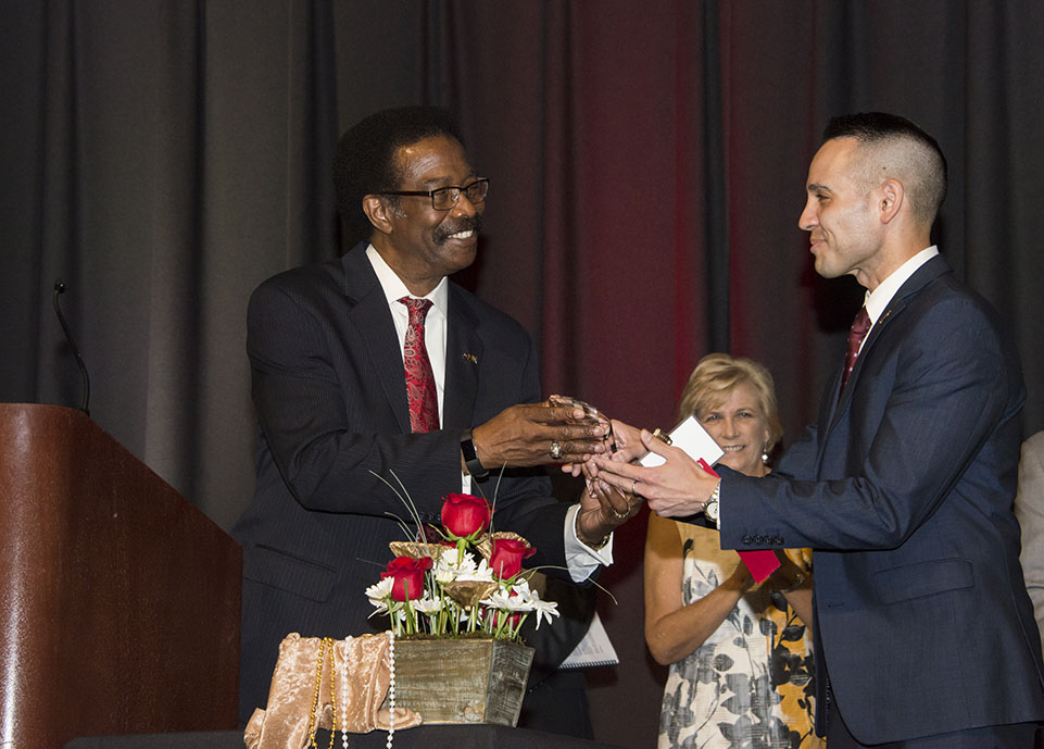Christopher Aston receives the 2017 Presidential Award during the 51st annual Staff Service Awards.