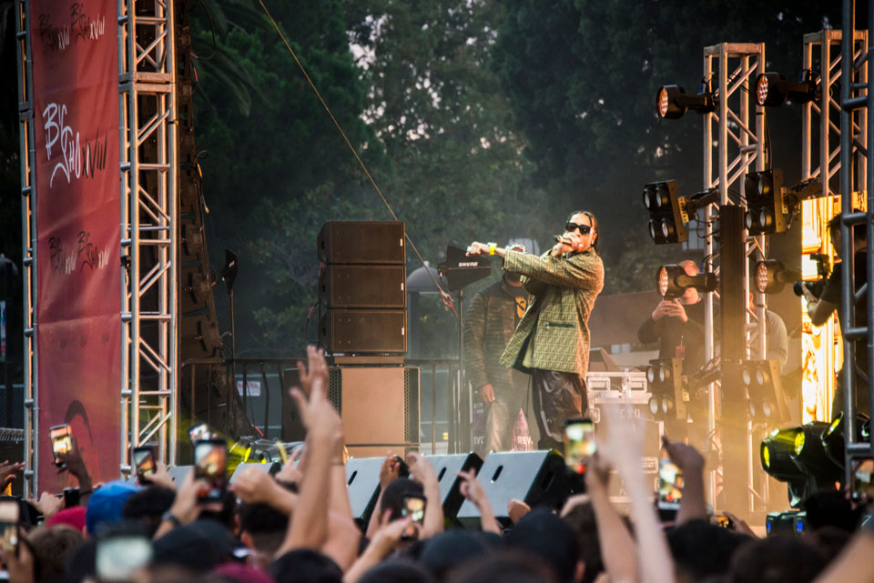 Rap artist Tyga performing on stage.