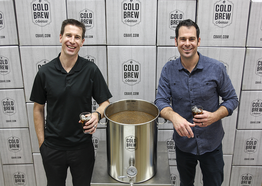 Brendan and Cary stand next to their Cold Brew Avenue keg.