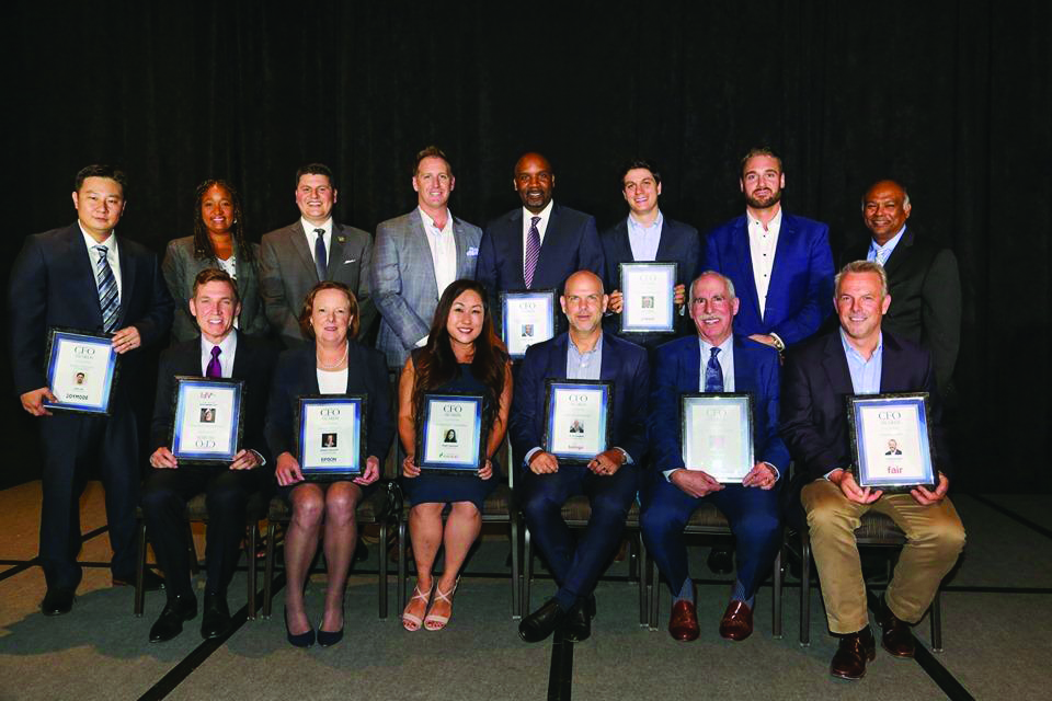 Nazarian College alumni Jang Lee (standing, at far left), Lang Fredrickson (sitting, at far left) and Andrea Zoeckler (sitting, second from left) are among those honored at the Los Angeles Business Journal’s 2019 CFO Awards. Also pictured: Nazarian College Dean Chandra Subramaniam (standing, at far right).