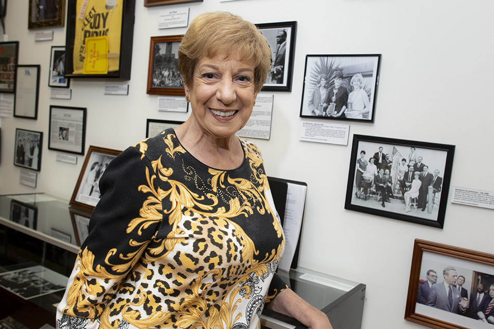 Leah Cartabruno stands in front of archived footage at The Museum of the San Fernando Valley Museum