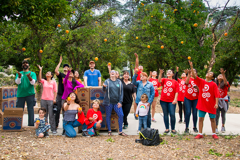 A group photo of the Orange Pick volunteers and community members at CSUN's Orange Pick Day in June 2018.