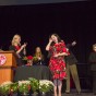 Susan Dickman wipes away a tear as she is applauded by CSUN President Dianne F. Harrison and other cabinet members.