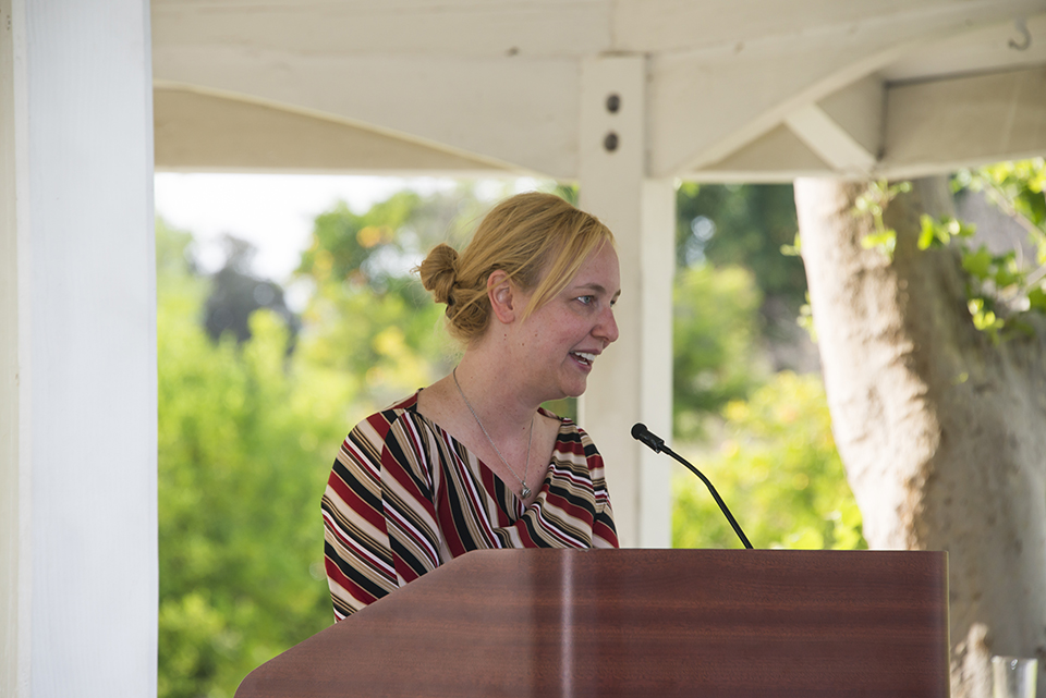Sheree M. Schrager speaks at a podium in a gazebo at the Orange Grove Bistro.