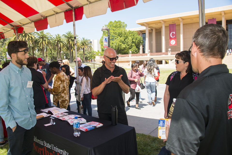 Incoming CSUN families speaking with CSUN Expo participants in the Sierra Quad.