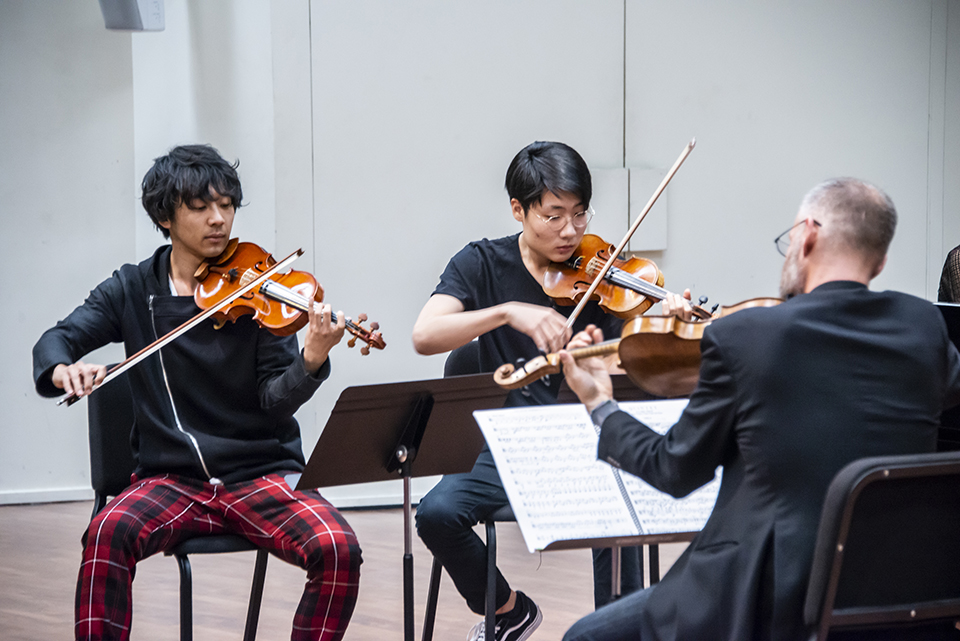 Violinists Kazeoki Katagiri and Joshua Rim perform in Bin Huang's master class at CSUN's ChamberFest.