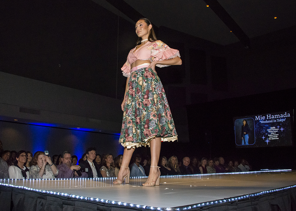 Woman in dress on the runway.